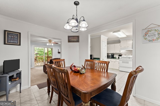 tiled dining area with ceiling fan with notable chandelier and ornamental molding