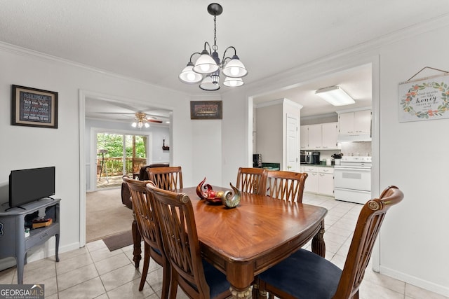 dining space featuring crown molding, light tile patterned flooring, and baseboards