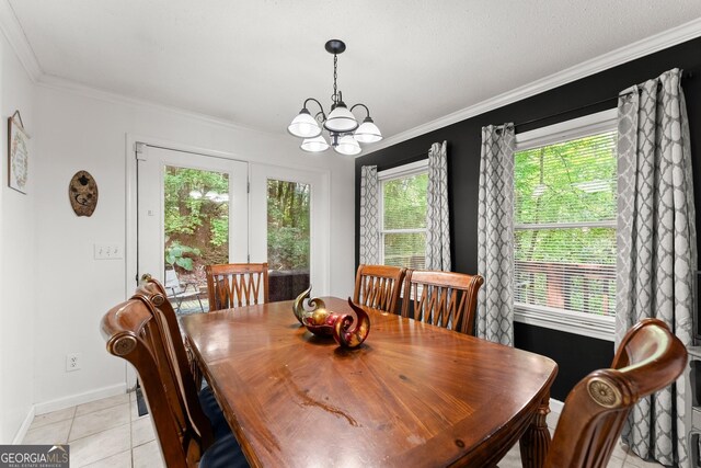 tiled dining area with crown molding and a chandelier