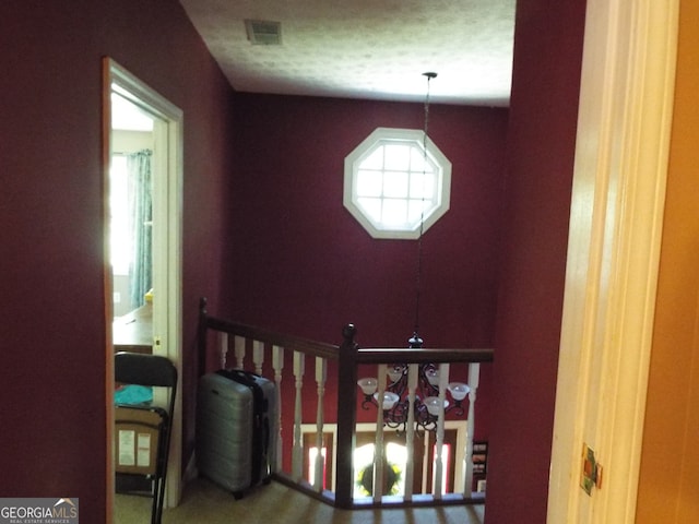 interior space with a textured ceiling