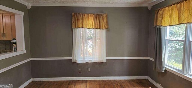 unfurnished dining area featuring hardwood / wood-style flooring