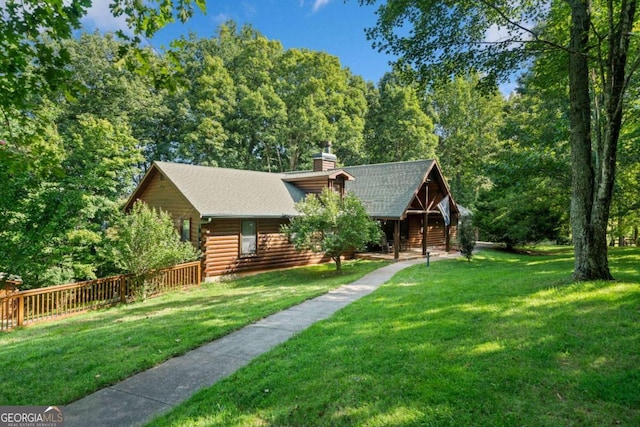 log-style house featuring a front lawn