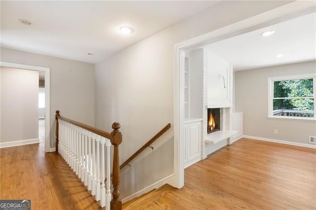 staircase with wood-type flooring