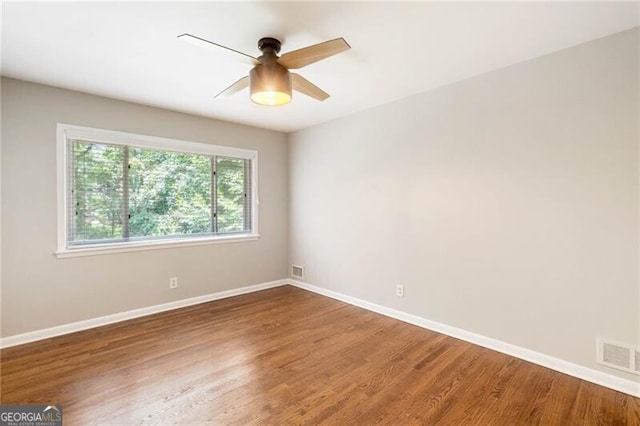 unfurnished room featuring hardwood / wood-style flooring and ceiling fan