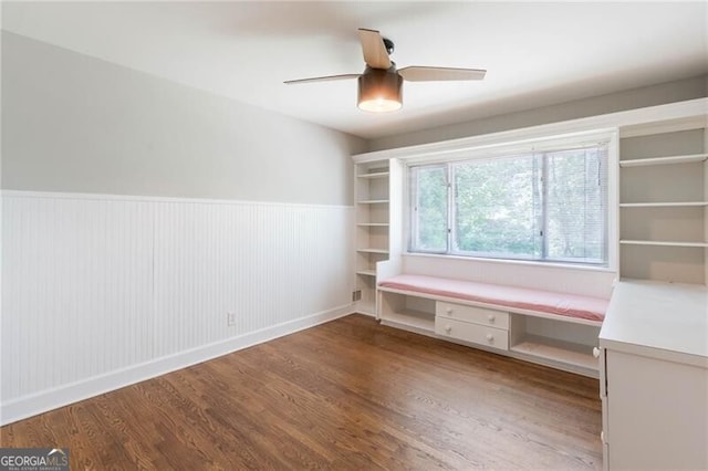 interior space featuring ceiling fan and wood-type flooring