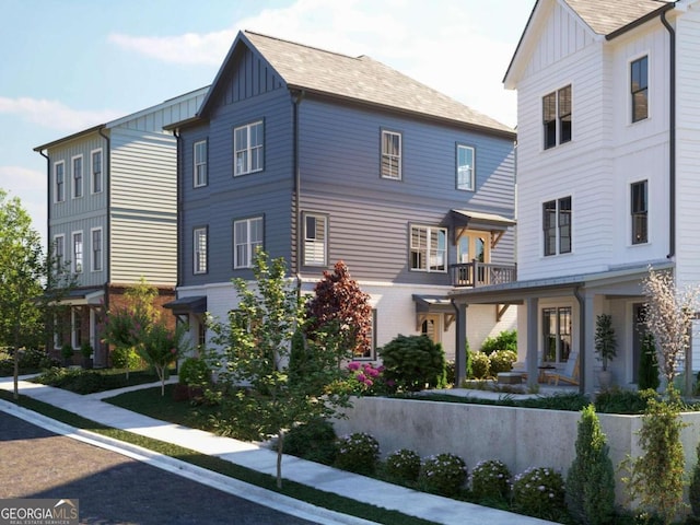 view of front of house with a balcony