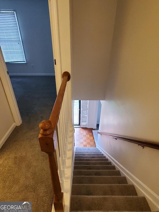 stairs with carpet flooring