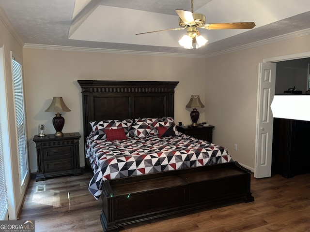 bedroom with baseboards, ornamental molding, dark wood finished floors, and a ceiling fan