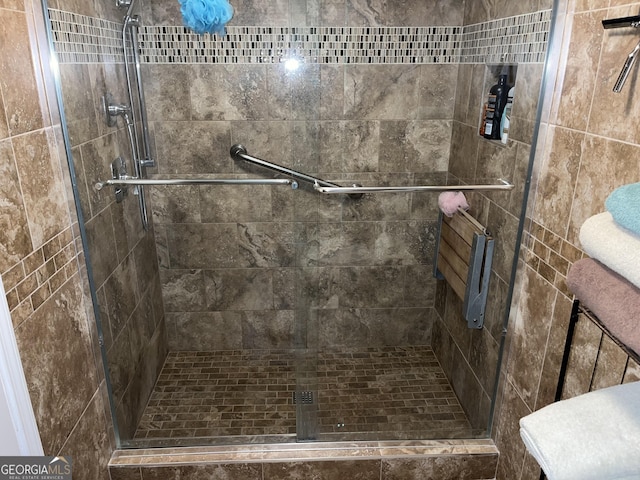 bathroom featuring a shower stall