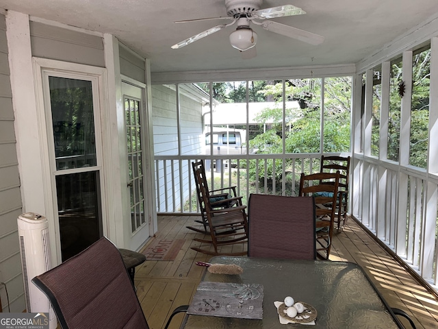 sunroom / solarium with ceiling fan