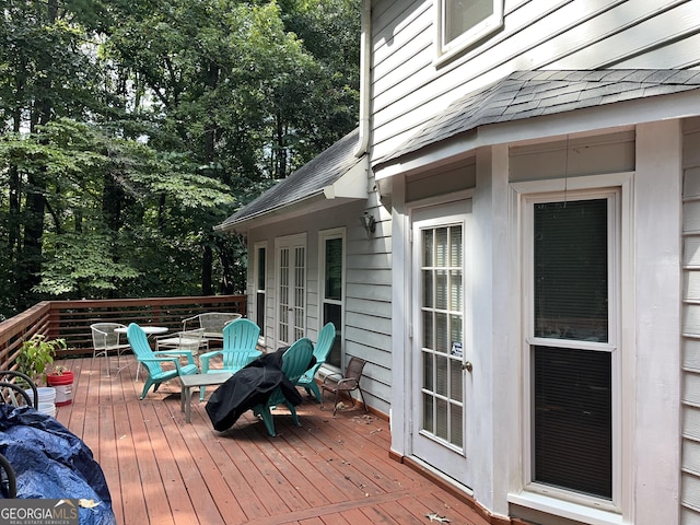 deck featuring outdoor dining area