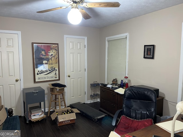 home office with ceiling fan, a textured ceiling, baseboards, and wood finished floors