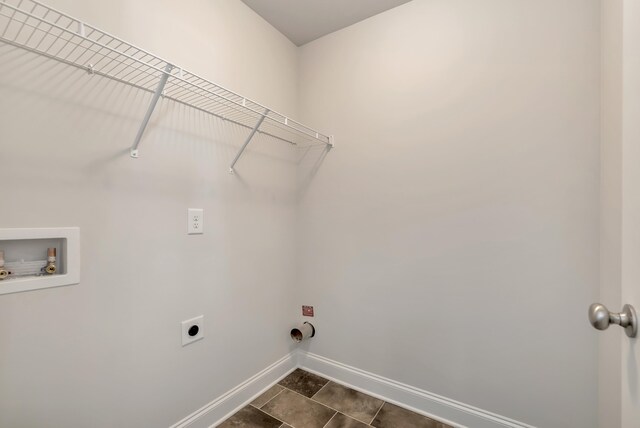 laundry area featuring hookup for an electric dryer, washer hookup, dark tile patterned floors, and gas dryer hookup