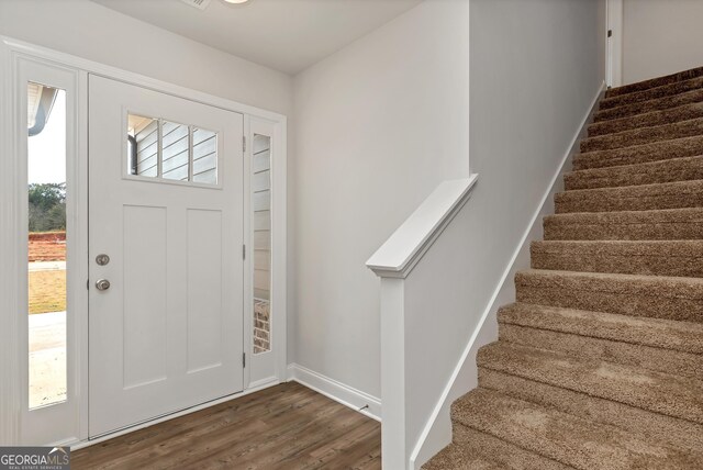 entrance foyer featuring dark hardwood / wood-style floors