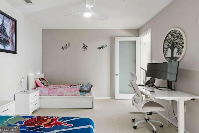 carpeted bedroom with baseboards and a ceiling fan