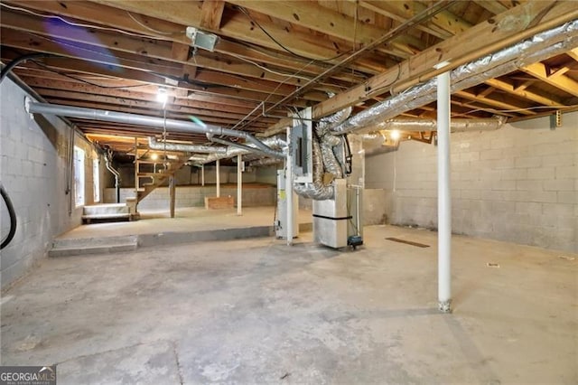 unfinished below grade area with water heater and heating unit