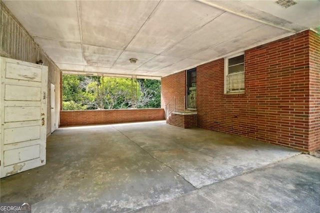 view of patio / terrace with an attached carport