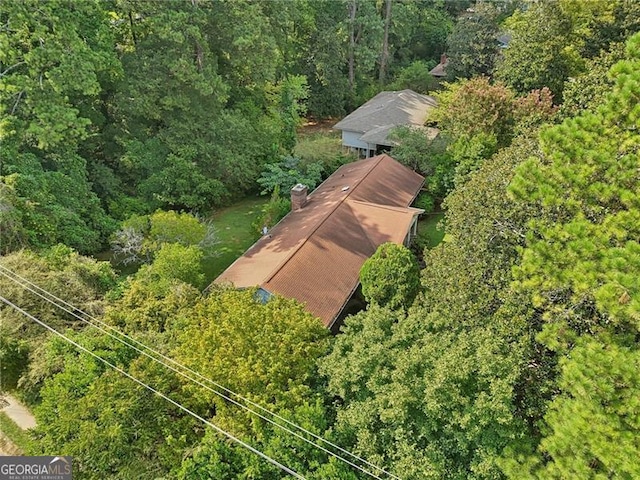 aerial view featuring a view of trees