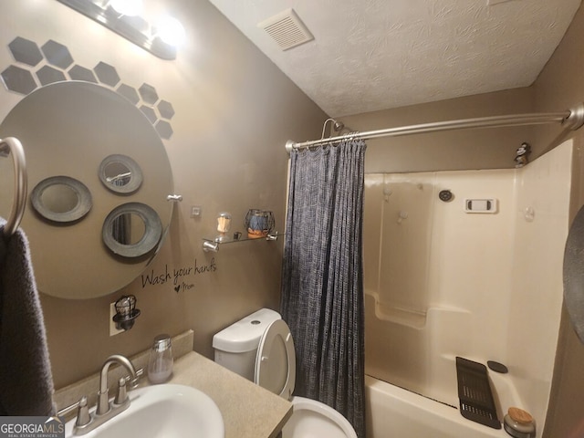 full bathroom with shower / bath combination with curtain, toilet, a textured ceiling, and vanity