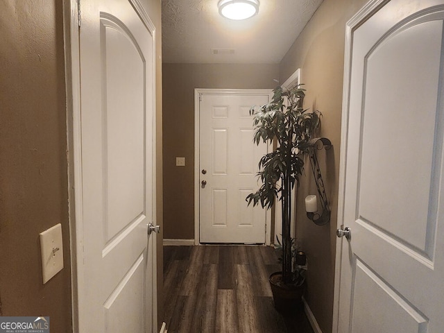 doorway featuring dark hardwood / wood-style flooring