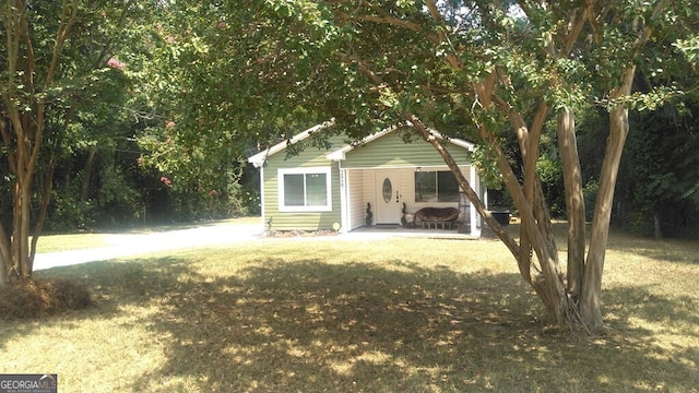 view of outbuilding with a yard