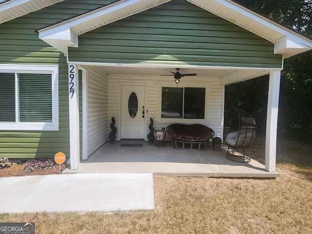 exterior space with ceiling fan