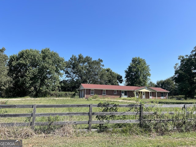 view of yard with a rural view