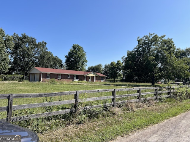 view of yard with a rural view