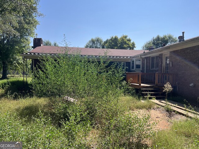 view of yard featuring a wooden deck