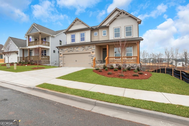 craftsman-style house featuring covered porch and a front lawn