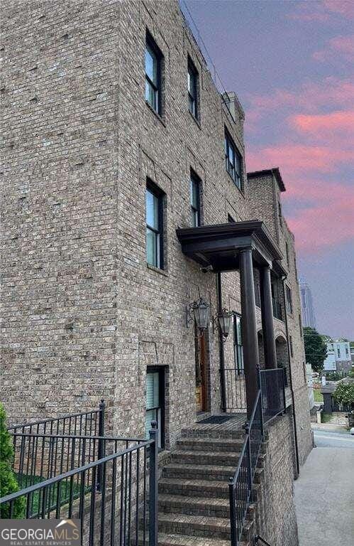 view of outdoor building at dusk