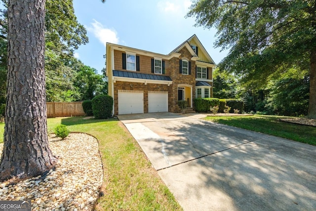 view of front of property with a garage and a front yard