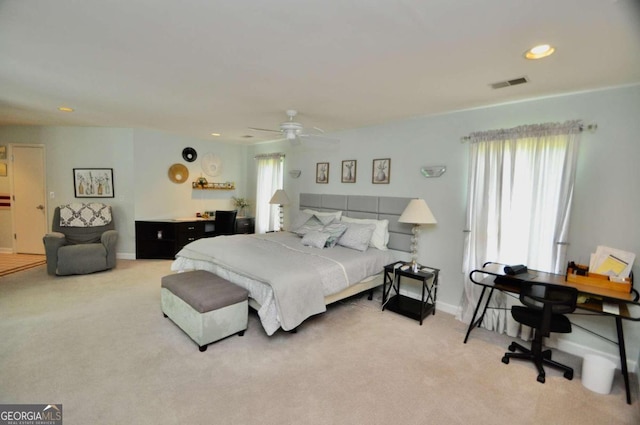 carpeted bedroom with ceiling fan, visible vents, baseboards, and recessed lighting