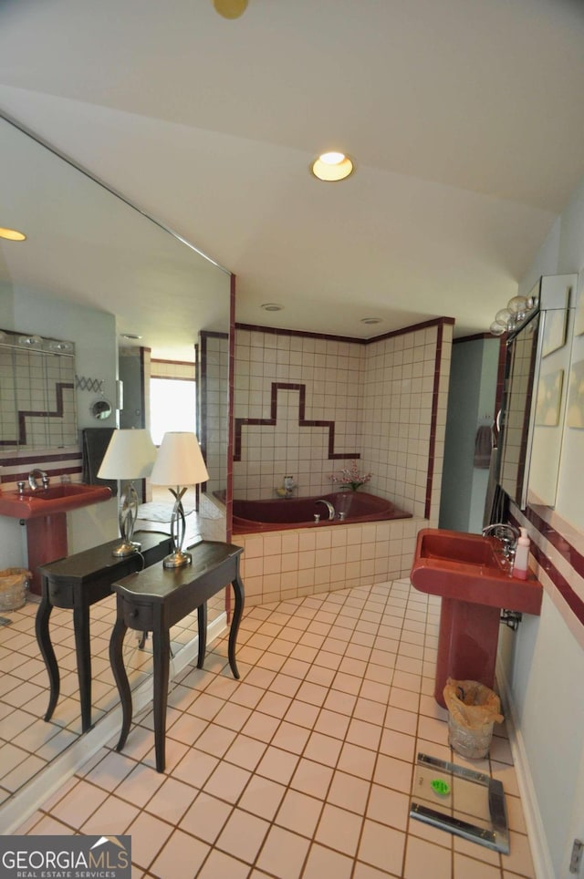 full bathroom with recessed lighting, tiled tub, and tile patterned floors