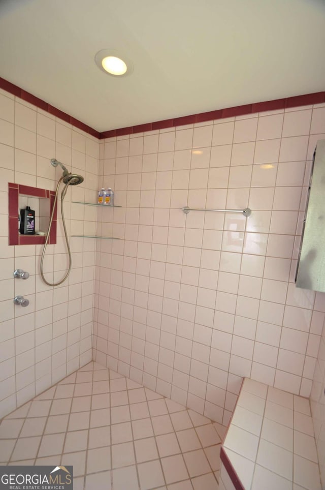 full bathroom with tiled shower