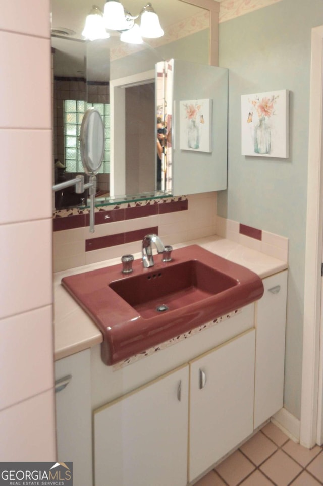 bathroom with vanity and decorative backsplash