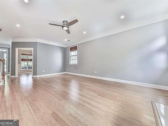 unfurnished living room with ceiling fan, light hardwood / wood-style floors, and ornamental molding