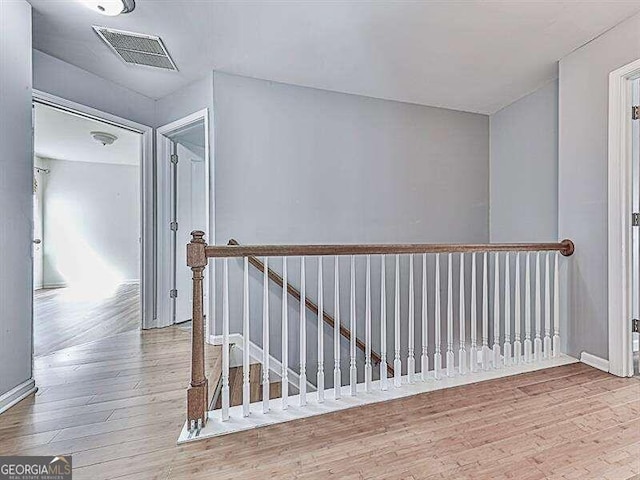 hallway featuring hardwood / wood-style flooring