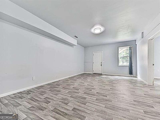 spare room featuring light wood-type flooring