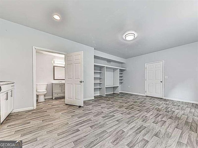 unfurnished bedroom featuring light wood-type flooring