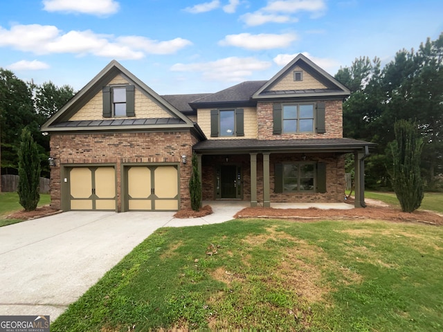 craftsman inspired home with a garage, a front lawn, and covered porch