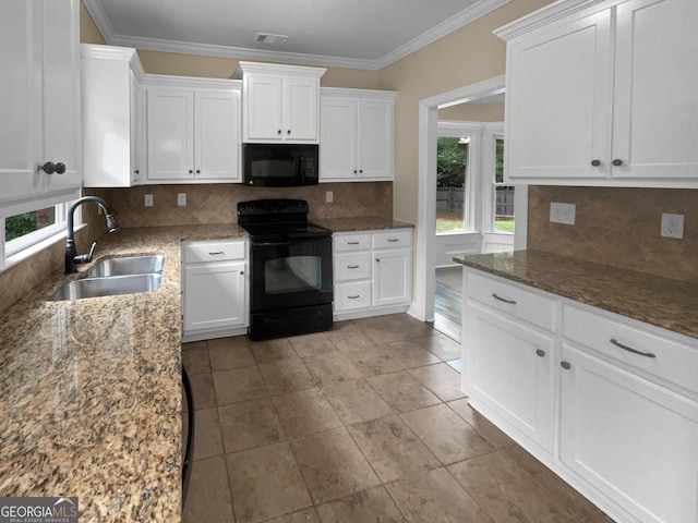 kitchen with stone counters, crown molding, black appliances, white cabinetry, and a sink