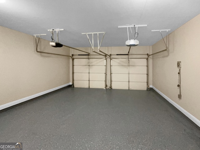 garage featuring baseboards and a garage door opener