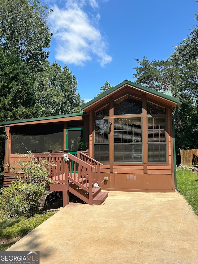 rear view of property with a patio area