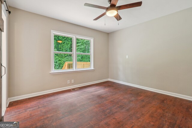 unfurnished room with ceiling fan and wood-type flooring