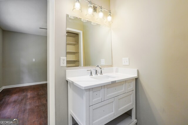 bathroom featuring vanity and wood-type flooring