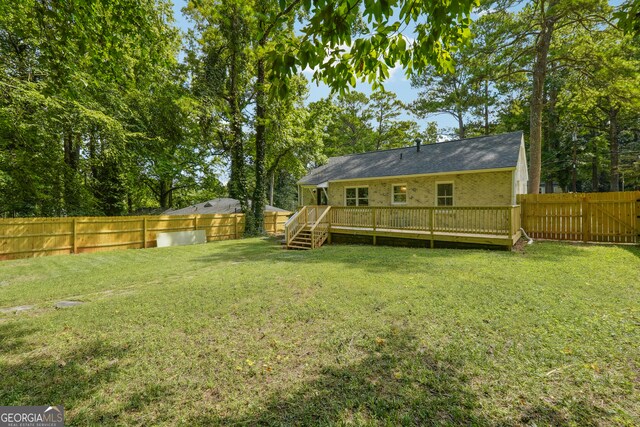 view of yard with a deck