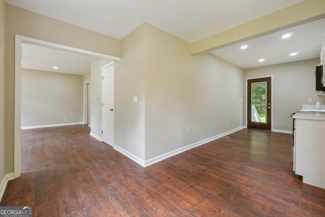 unfurnished living room featuring wood-type flooring