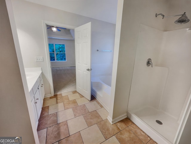 full bathroom with a bathtub, tile patterned floors, vanity, and walk in shower