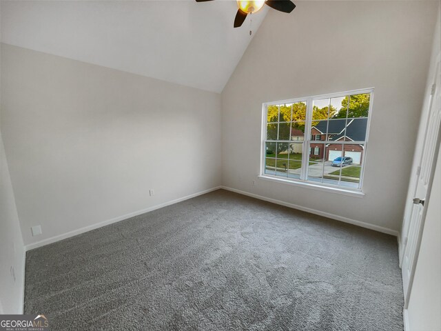 unfurnished room featuring carpet floors, ceiling fan, high vaulted ceiling, and baseboards